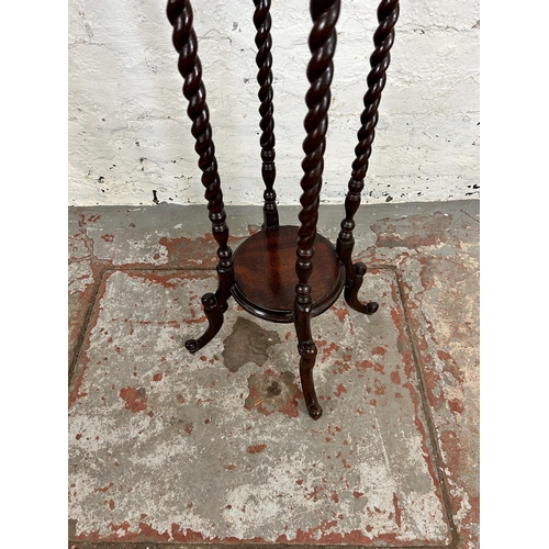 45 - A 19th century style mahogany barley twist two tier jardinière stand