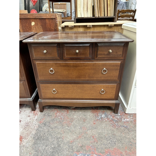 47 - A Stag Minstrel mahogany chest of three short over two long drawers