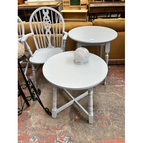 54 - Eight items, two grey painted circular occasional tables, two grey painted wheel back carver dining ... 