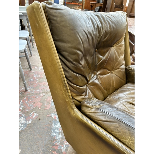 56 - A 1970s Everest Furniture green leather armchair