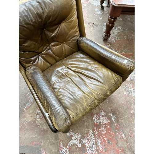 56 - A 1970s Everest Furniture green leather armchair