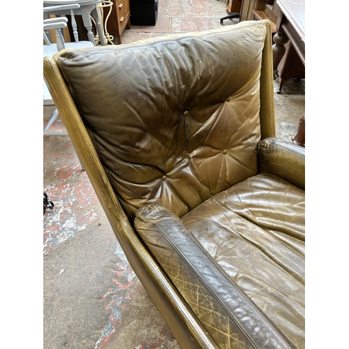 56 - A 1970s Everest Furniture green leather armchair