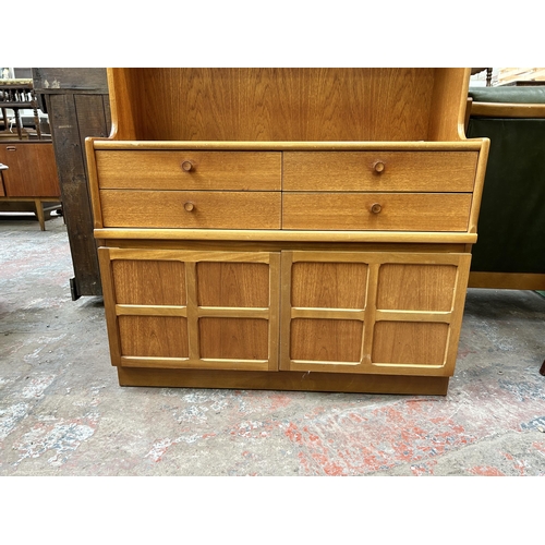 64 - A Nathan teak bookcase with four drawers and two lower cupboard doors - approx. 194cm high x 102cm w... 