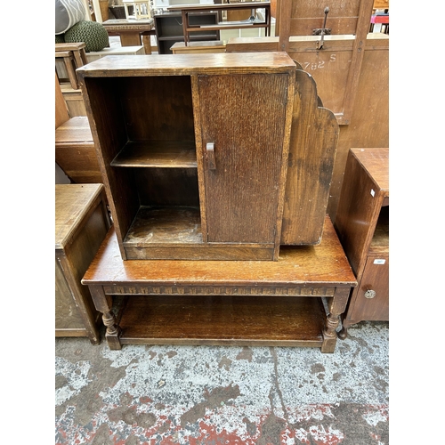 66 - Five pieces of oak furniture to include Art Deco bookcase with external newspaper rack, bedside cabi... 