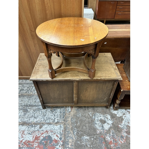 66 - Five pieces of oak furniture to include Art Deco bookcase with external newspaper rack, bedside cabi... 