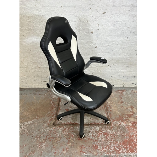 67 - A modern black and white leatherette gaming desk chair