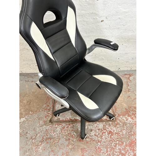 67 - A modern black and white leatherette gaming desk chair