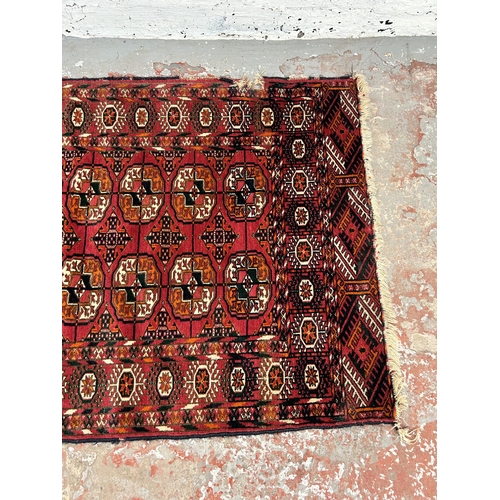 73 - A vintage Turkman Tekke rug - approx. 115cm x 84cm