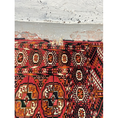 73 - A vintage Turkman Tekke rug - approx. 115cm x 84cm