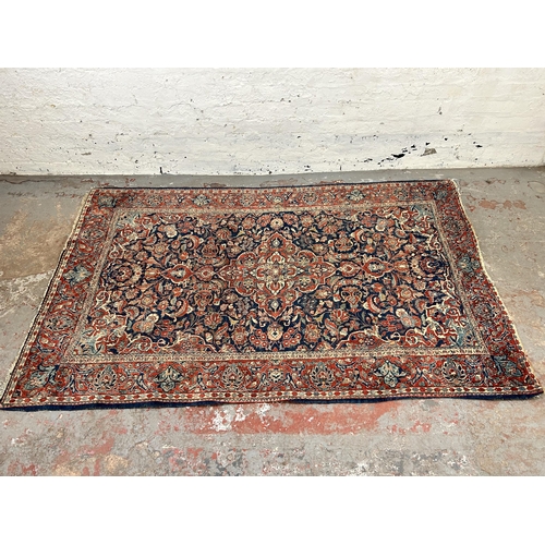 74 - A vintage Kashan rug - approx. 207cm long x 131cm wide