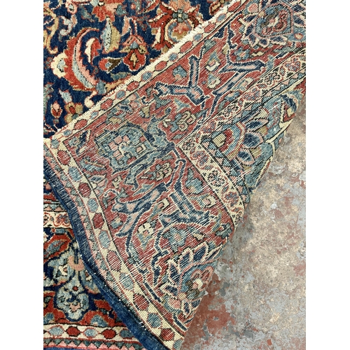 74 - A vintage Kashan rug - approx. 207cm long x 131cm wide