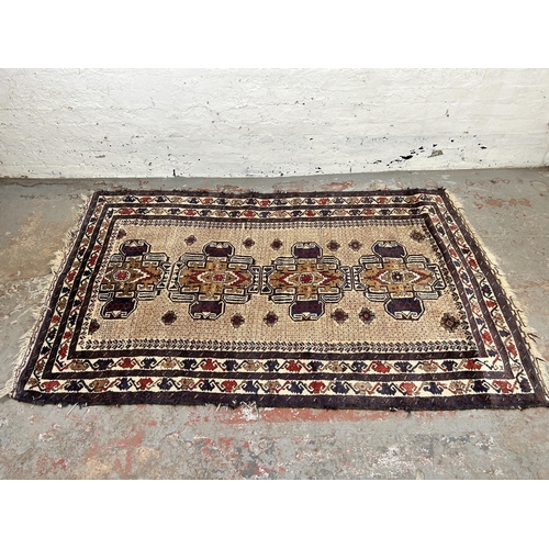 74A - A vintage Afghan hand made rug