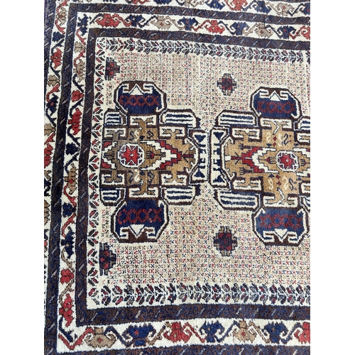 74A - A vintage Afghan hand made rug