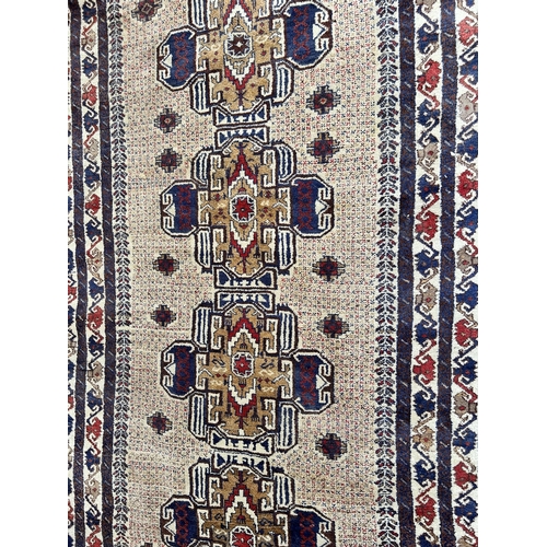 74A - A vintage Afghan hand made rug