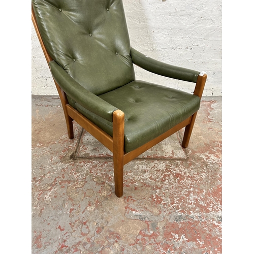 82 - A mid 20th century beech and green vinyl armchair