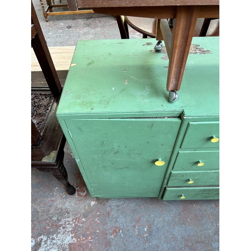 83 - Two pieces of mid 20th century furniture, one teak telephone seat and one green painted sideboard