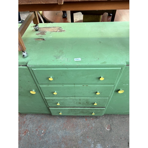 83 - Two pieces of mid 20th century furniture, one teak telephone seat and one green painted sideboard