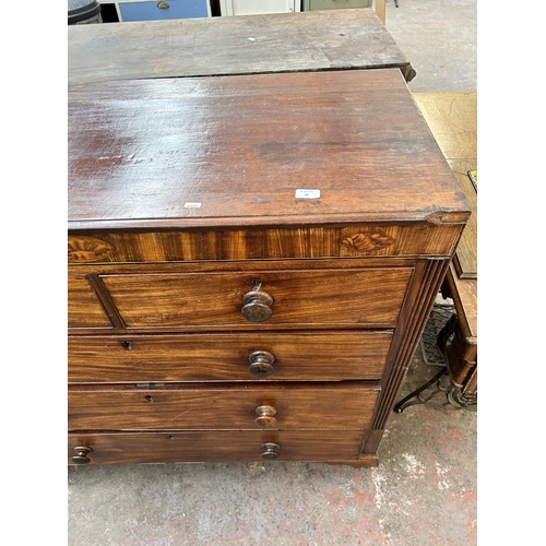 86 - A George III inlaid mahogany chest of two short over three long drawers with bracket supports