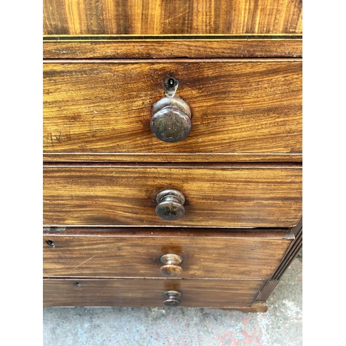 86 - A George III inlaid mahogany chest of two short over three long drawers with bracket supports