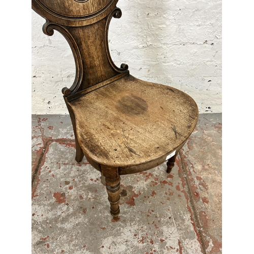 87 - A 19th century mahogany hall chair