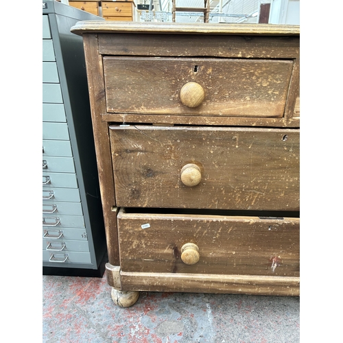 89 - A Victorian pine chest of two short over two long drawers