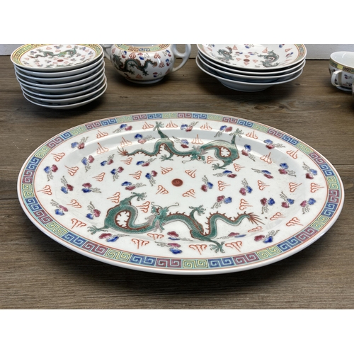 249 - A collection of Chinese Dragon pattern porcelain dinnerware