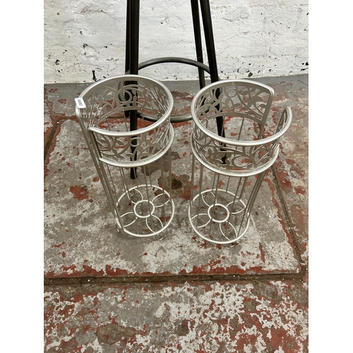 120 - Three items, one industrial style metal kitchen bar stool and two modern metal toilet roll holders