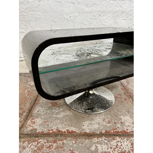 126 - A modern black plastic and chrome plated TV stand with internal glass shelf