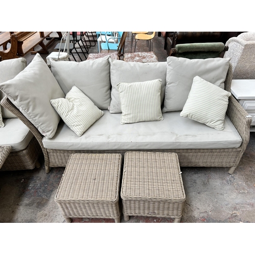 148 - A Bramblecrest wicker effect five piece garden suite comprising three seater sofa, two seater corner... 