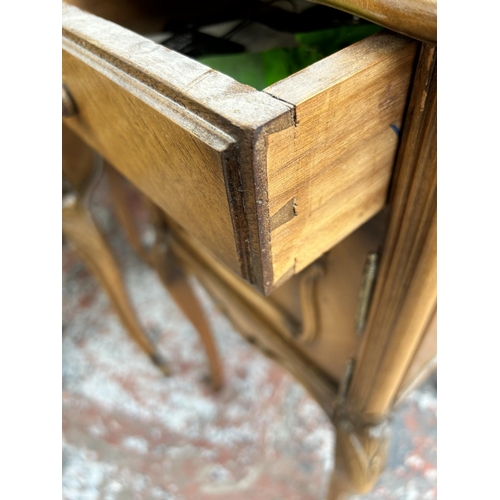 161 - Two French walnut and marble bedside cabinets