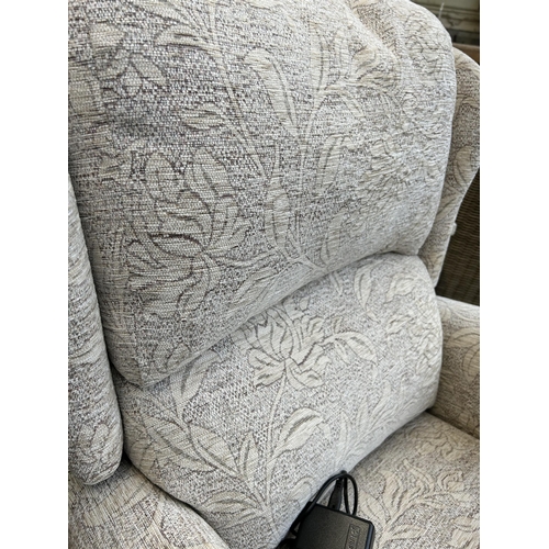 163 - A modern fabric upholstered electric reclining armchair with remote and power supply