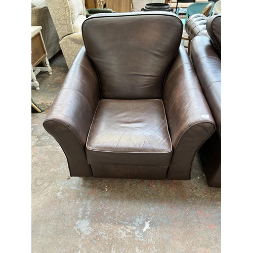 163A - A Marks & Spencer brown leather two piece lounge suite comprising three seater sofa and reclining ar... 