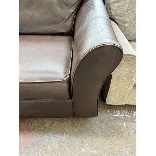 163A - A Marks & Spencer brown leather two piece lounge suite comprising three seater sofa and reclining ar... 