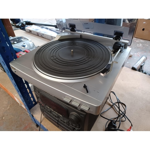 697 - Two Aiwa items, one PX-E860 two-speed turntable and one NSX-540 stereo system