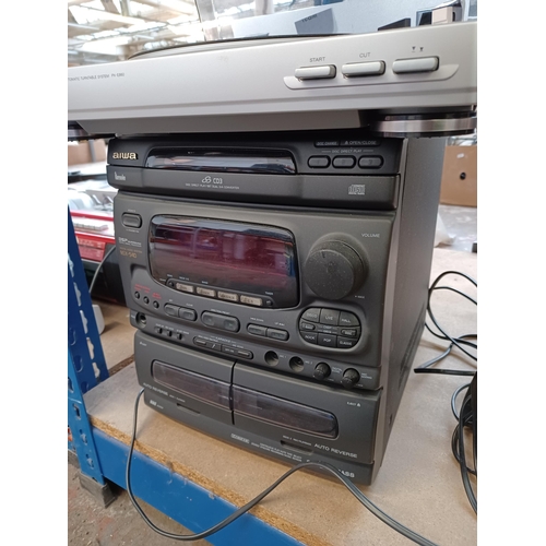 697 - Two Aiwa items, one PX-E860 two-speed turntable and one NSX-540 stereo system