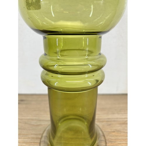 215 - A mid 20th century olive green bulbous vase in the manner of Oiva Toikka