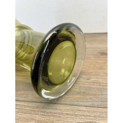 215 - A mid 20th century olive green bulbous vase in the manner of Oiva Toikka