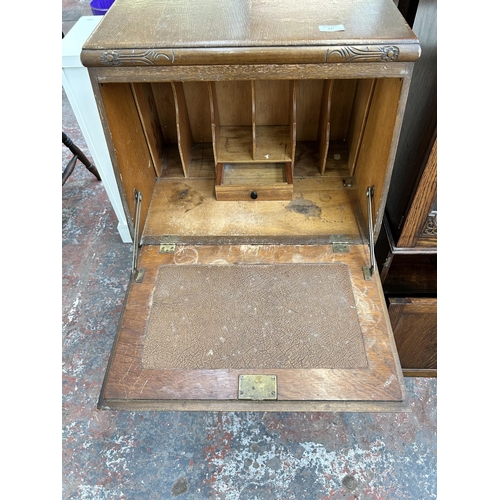 137 - A mid 20th century oak bureau with four drawers and fall front