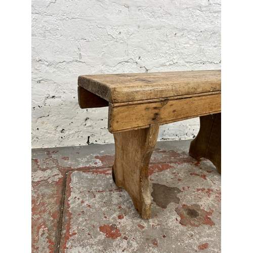 139 - A 19th century pine milking stool