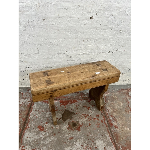 139 - A 19th century pine milking stool