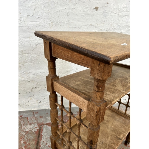 142 - An Arts and Crafts oak reading bookcase by Leonard Wyburd for Liberty & Co.