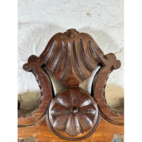 180 - An Edwardian carved mahogany framed wall mirror - approx.  78cm x 55cm wide