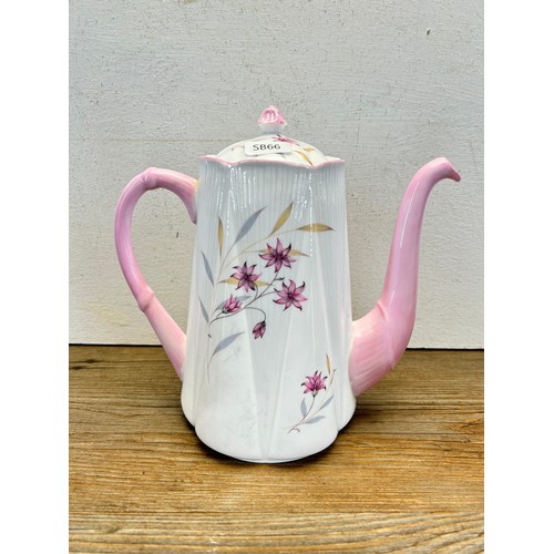 219 - Three Shelley Evening Star tea and coffee pots - largest approx. 21cm high