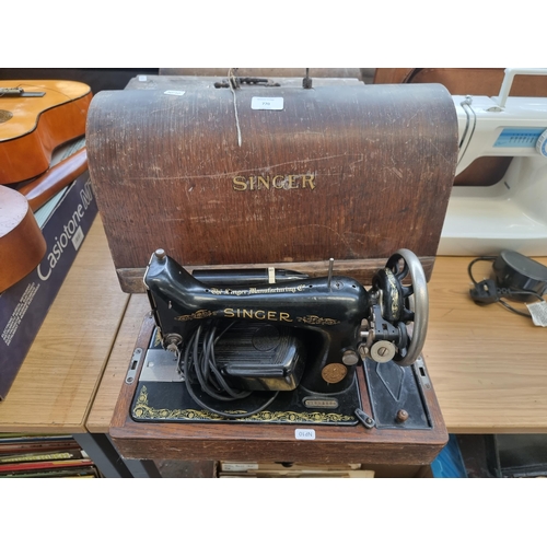 770 - A cased 1923 Singer 99K electric sewing machine with foot pedal and light