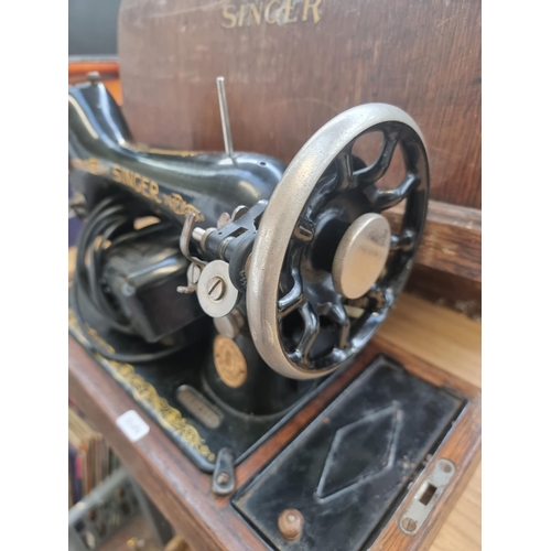 770 - A cased 1923 Singer 99K electric sewing machine with foot pedal and light