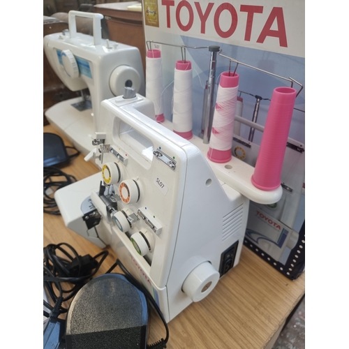 772 - A boxed Toyota SL3304 four-thread overlocking sewing machine with foot pedal and instruction manual