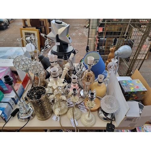 785 - A very large collection of table lamps and boxed lighting items