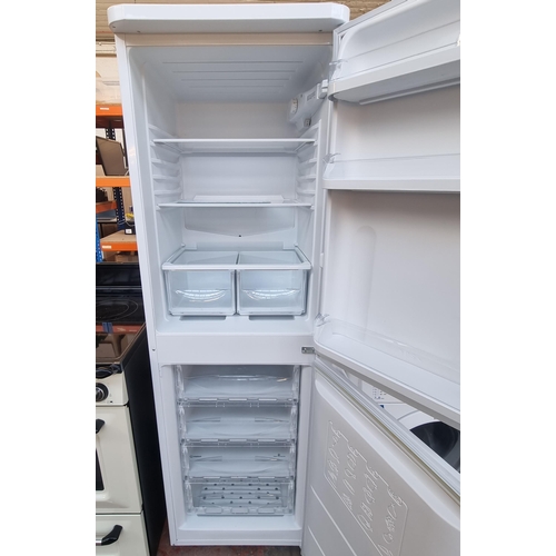 799 - An Indesit fridge freezer - approx. 54cm wide x 172cm high