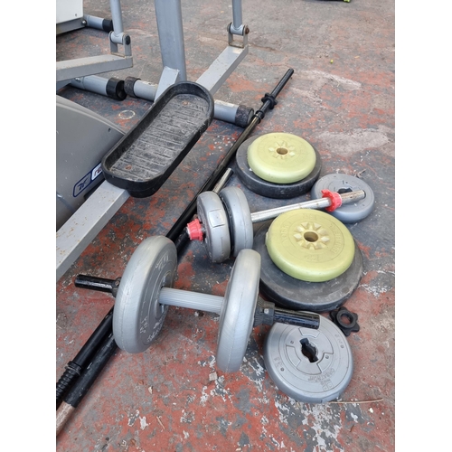 815 - A collection of exercise equipment to include V-Fit rowing machine, black metal barbell, Reebok cros... 