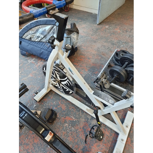 817 - A collection of exercise equipment to include Roger Black Fitness exercise bike, Body Train exercise... 